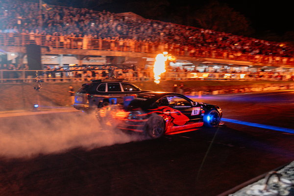 Jota Racing Challenge — 04 A red drift car slides through a cloud of smoke in front of the Desafio Jota Racing grandstands
